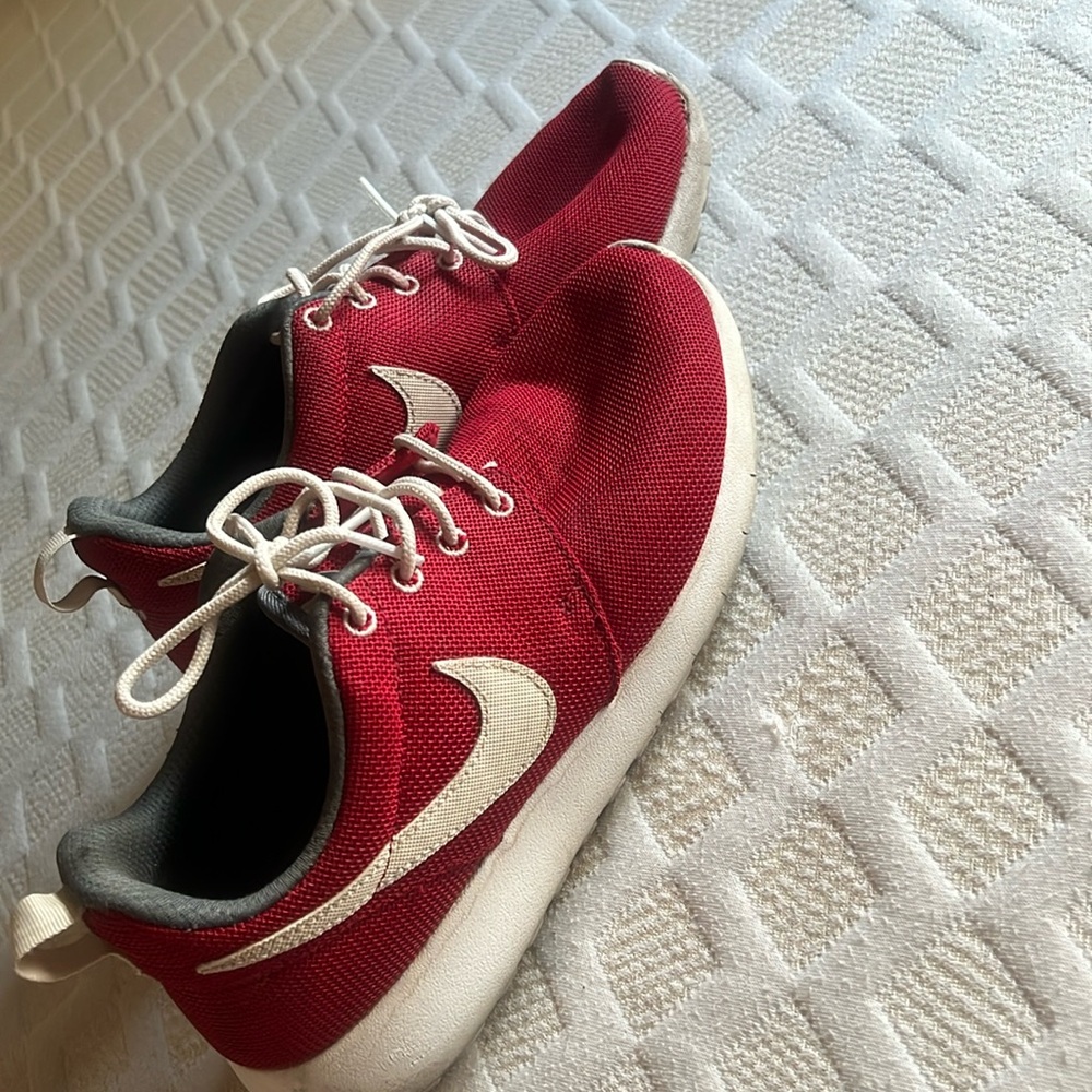 Red and white Nike Roshe